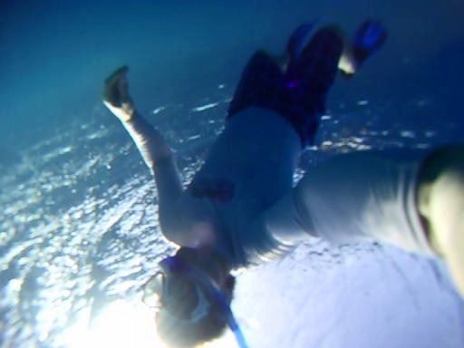 an underwater image of someone falling into the water