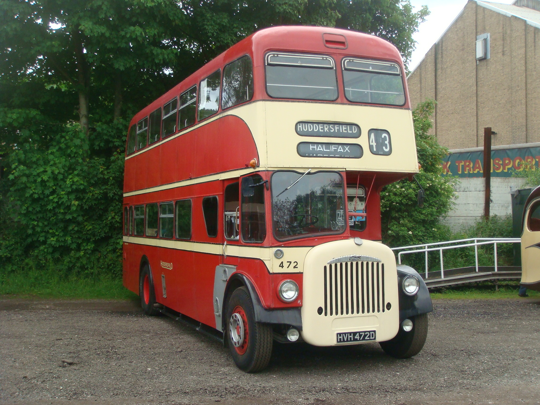 an old double decker bus parked in front of a building