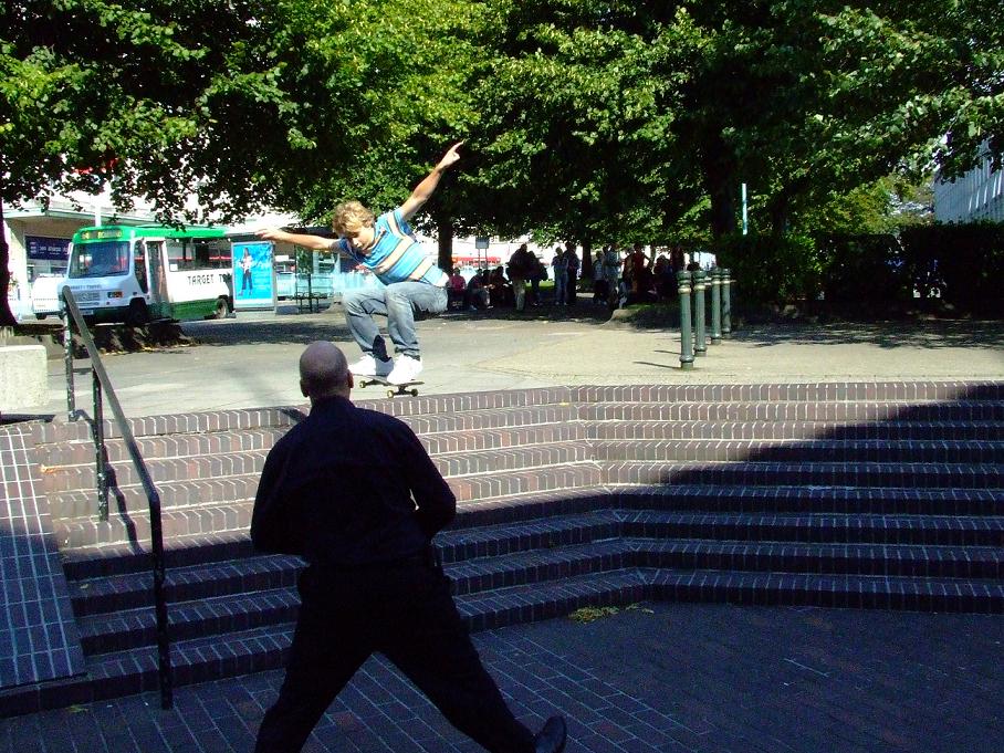 a man riding a skateboard down some steps