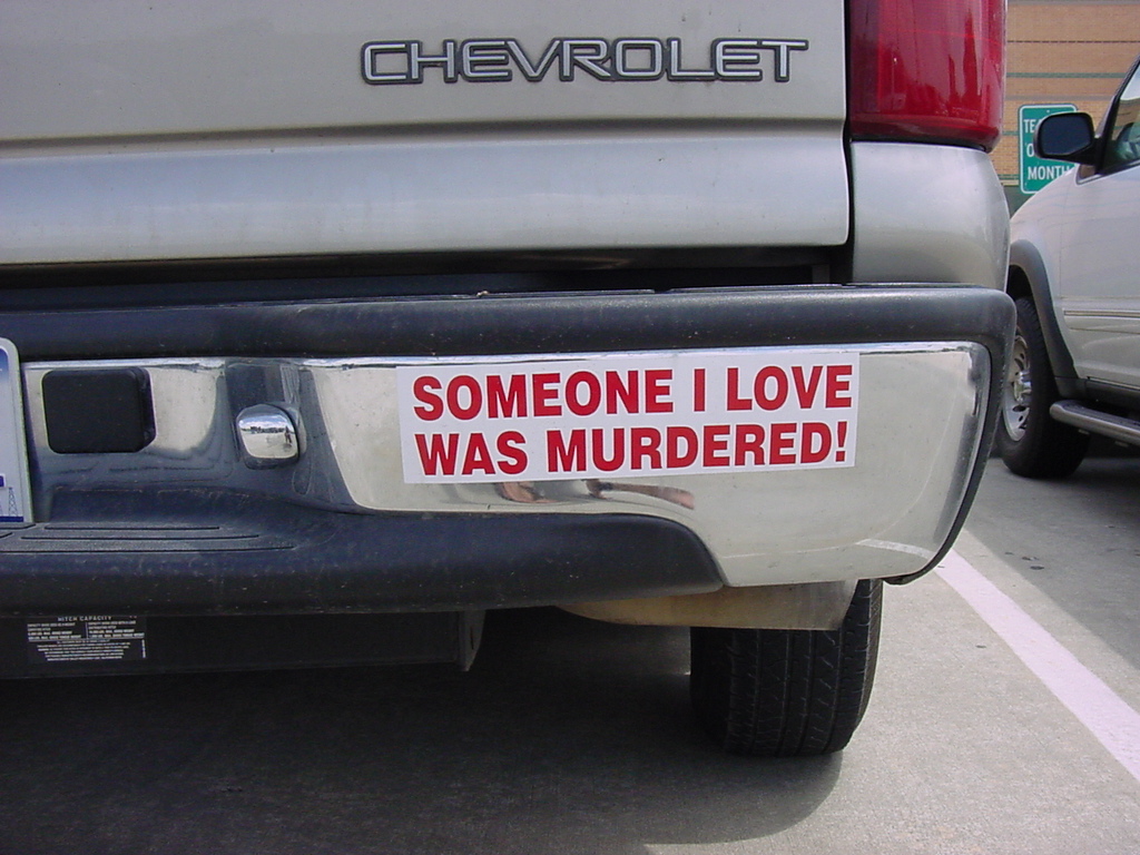 a sticker saying someone i love was murdered under the hood