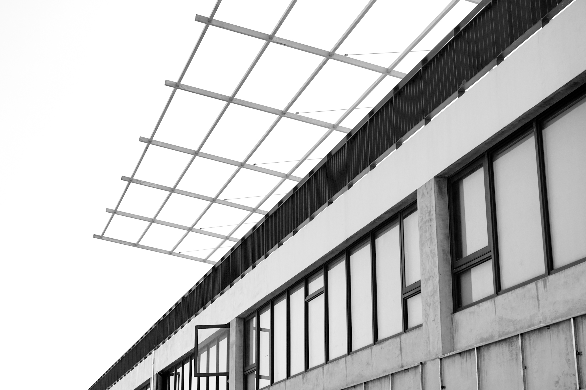 black and white pograph of windows and balcony at an industrial building
