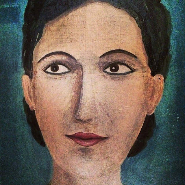 painting of fridacia, face of woman wearing white dress and with blue background