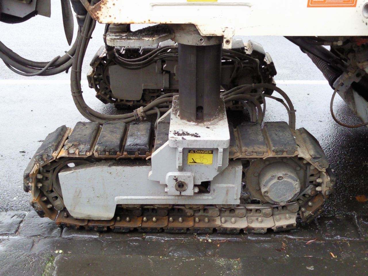 the back end of a vehicle with its tracks open