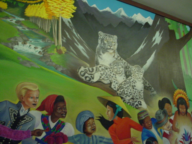 a mural with people and animals is shown