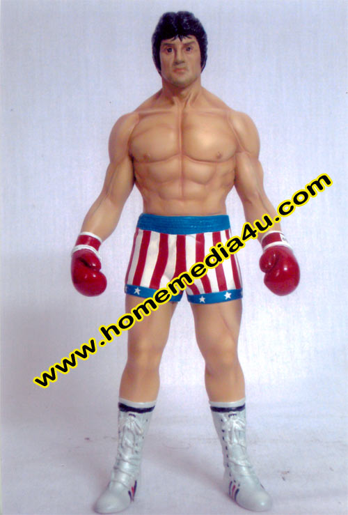a wrestler figure in shorts with boxing gloves on