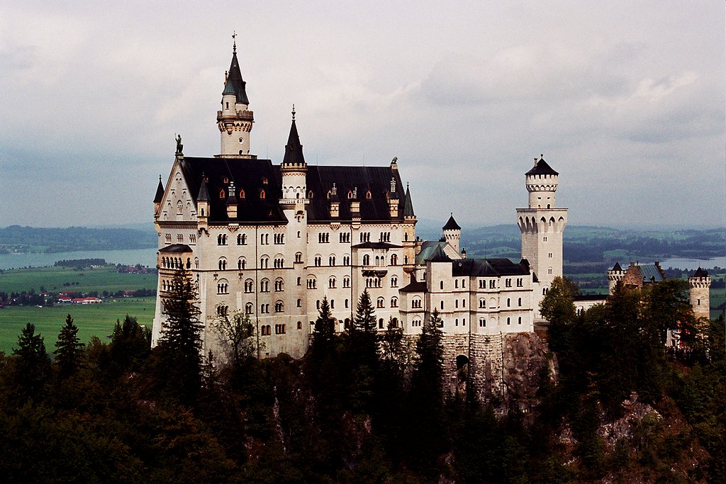 a view of a castle surrounded by lots of trees