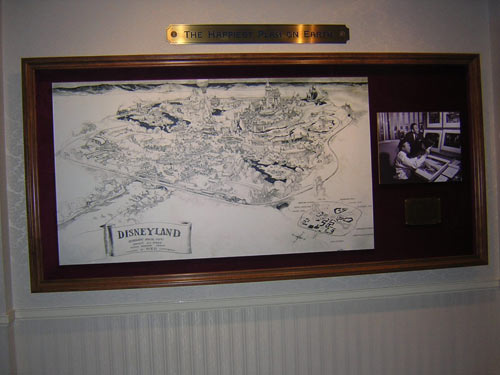 a framed drawing of the disneyland world