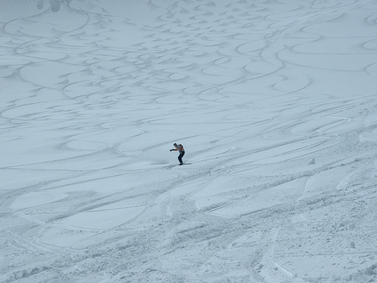the skier is skiing down the hill in the snow