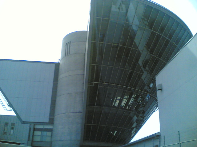 a building that is near another building with large windows