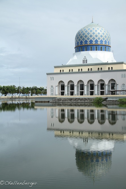 a large building that is next to a body of water