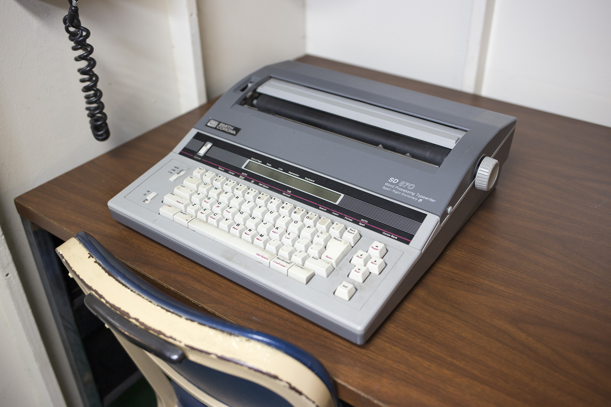 a computer that is sitting on top of a wooden desk