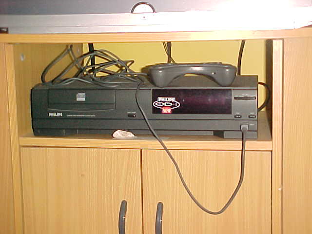 a computer monitor is on top of a dresser