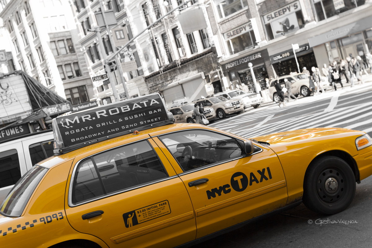 taxi cab parked on the street in new york