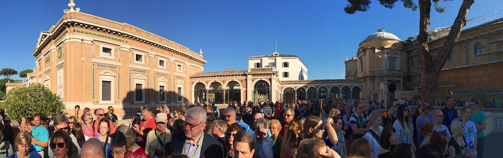 a crowd of people walking in the city