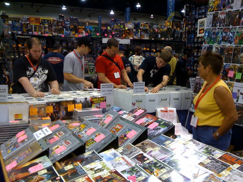 an image of several people buying comic books