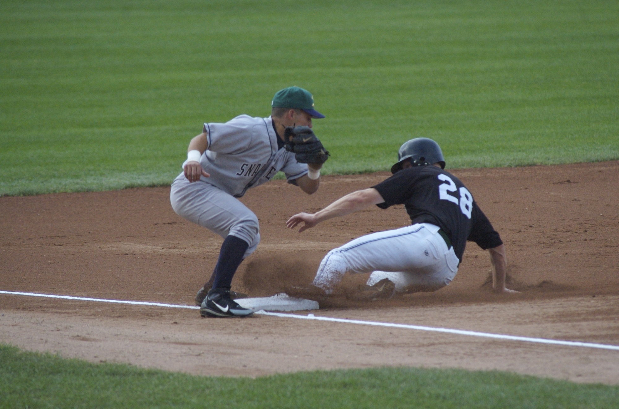 baseball players on the field with a base