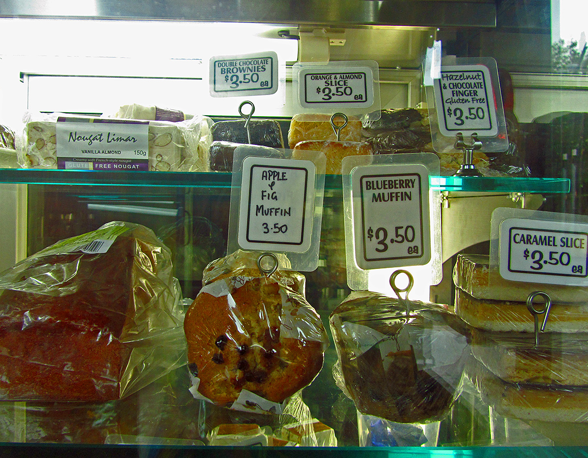 bread and pastries are displayed on a rack