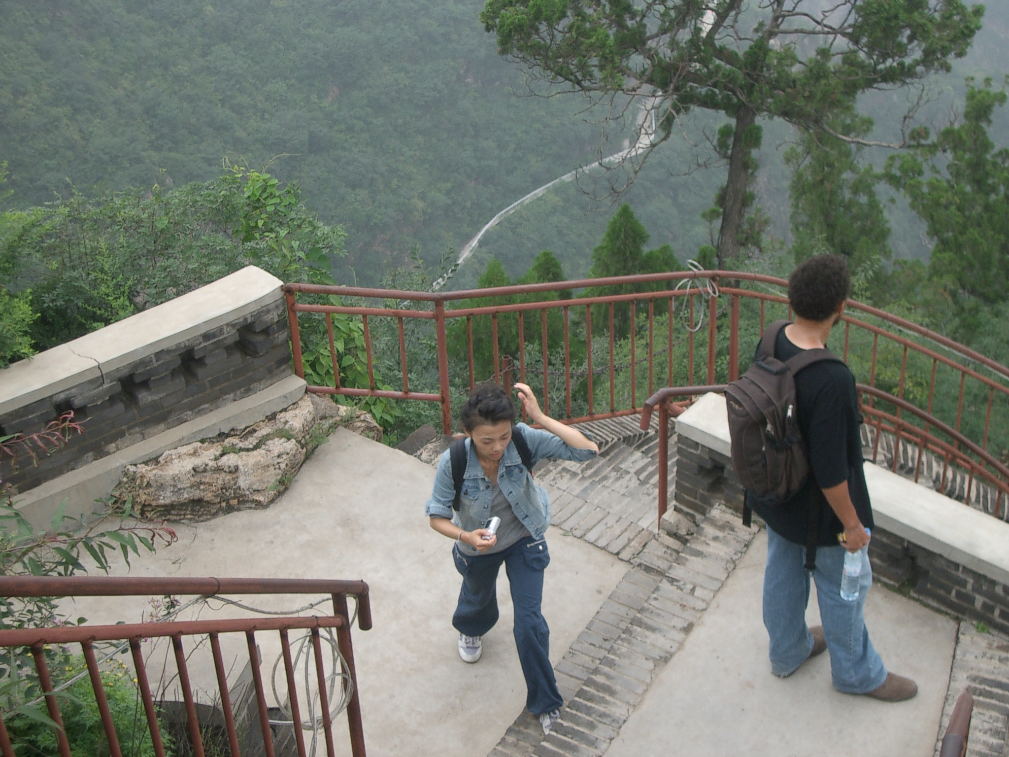 two young men are walking up some stairs