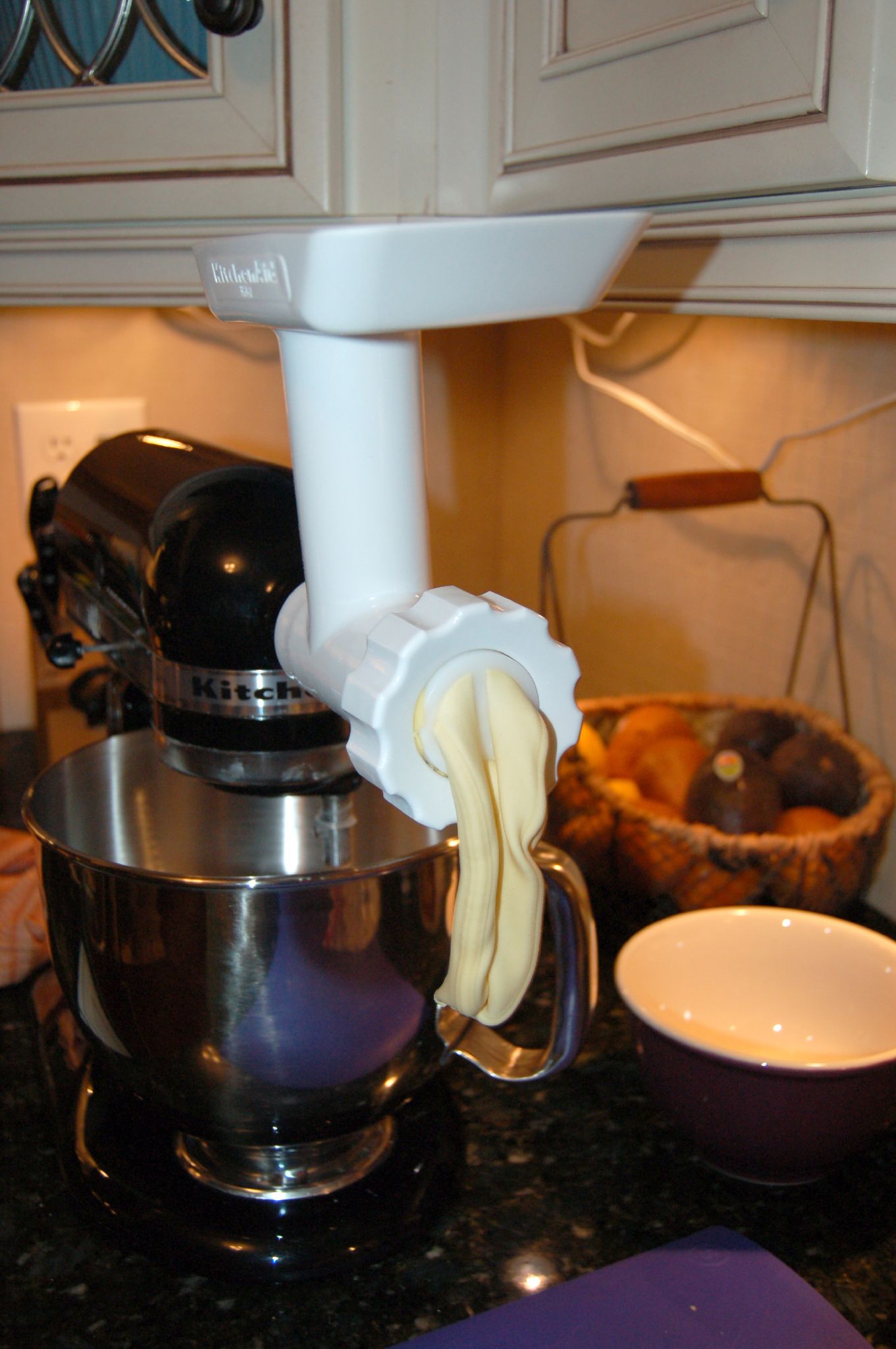 a food processor on a granite kitchen counter top