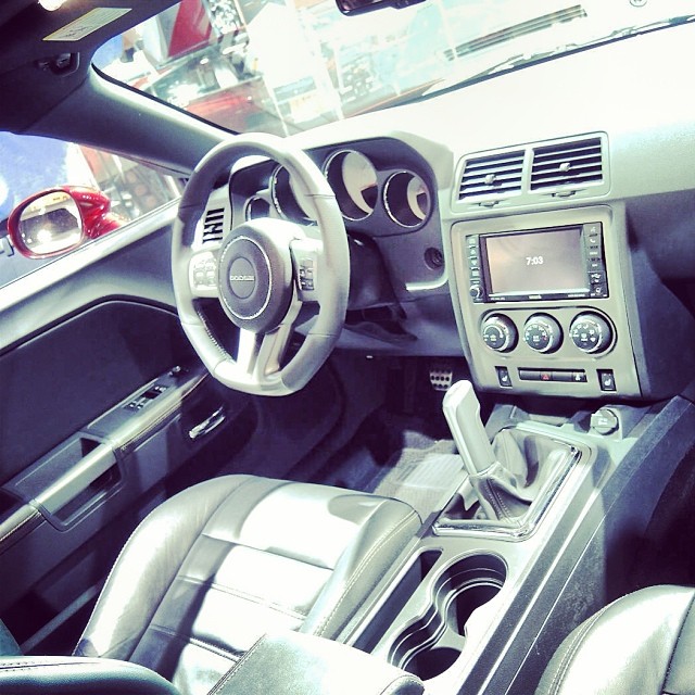 the interior of an automobile with a steering wheel
