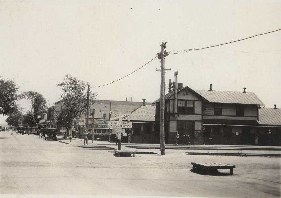 an old black and white po of a town on a street