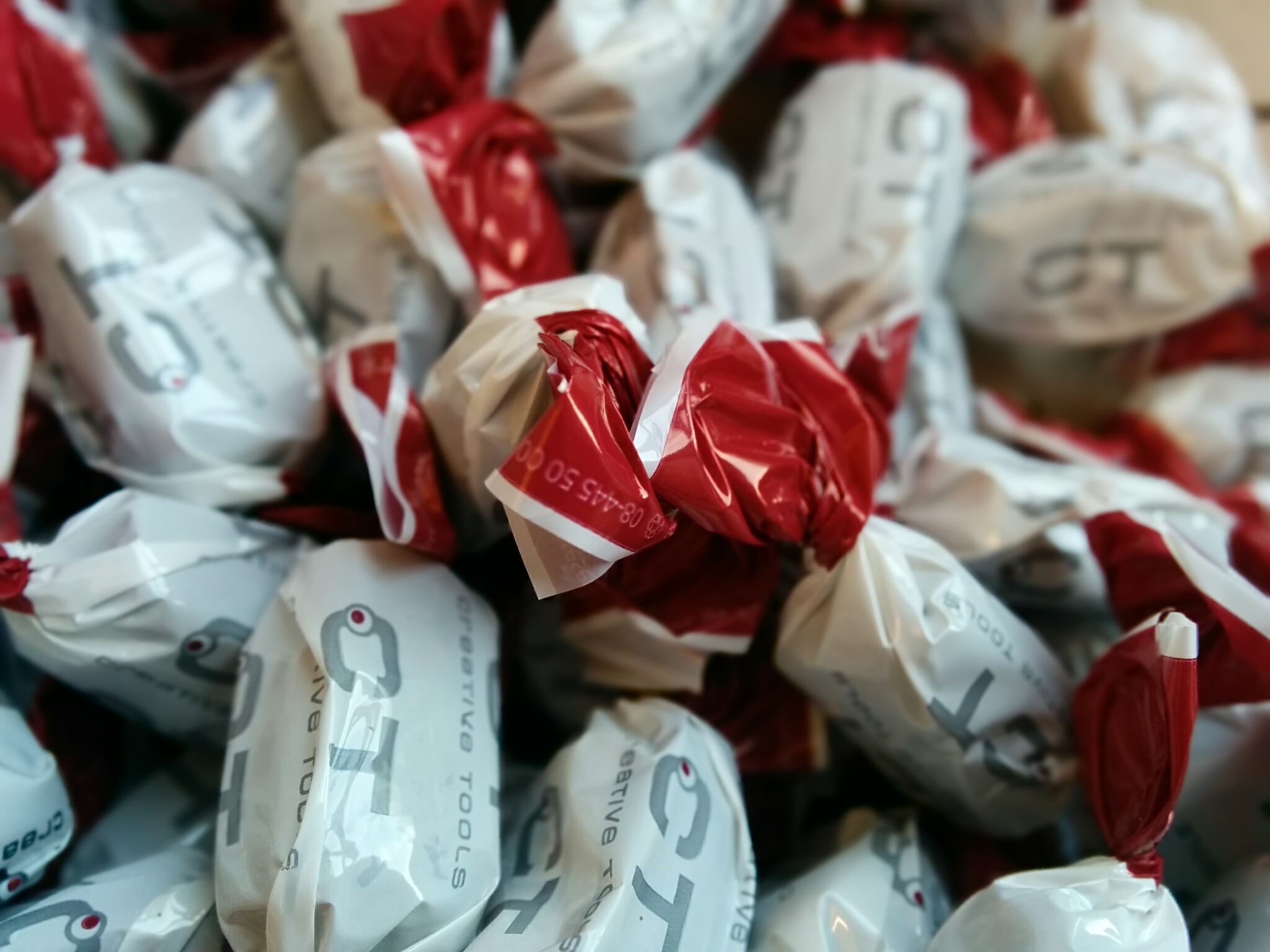 a pile of paper bag filled with red and white bags