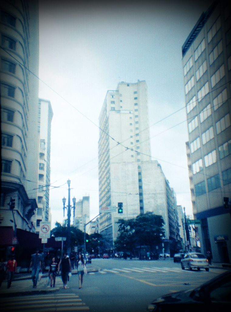 there are many tall buildings on this city street