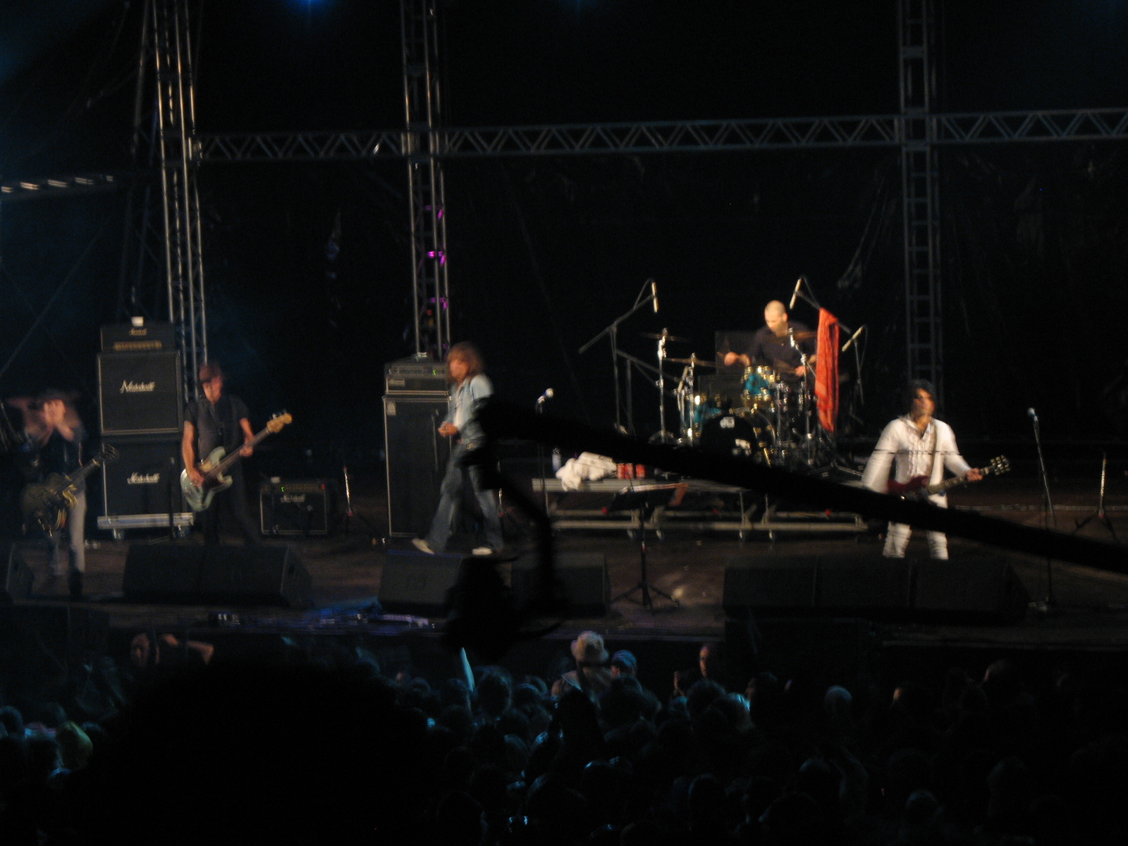 a group of men with guitars performing on stage