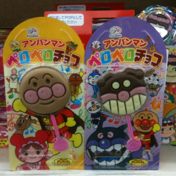 three different shaped toy candy pops in display