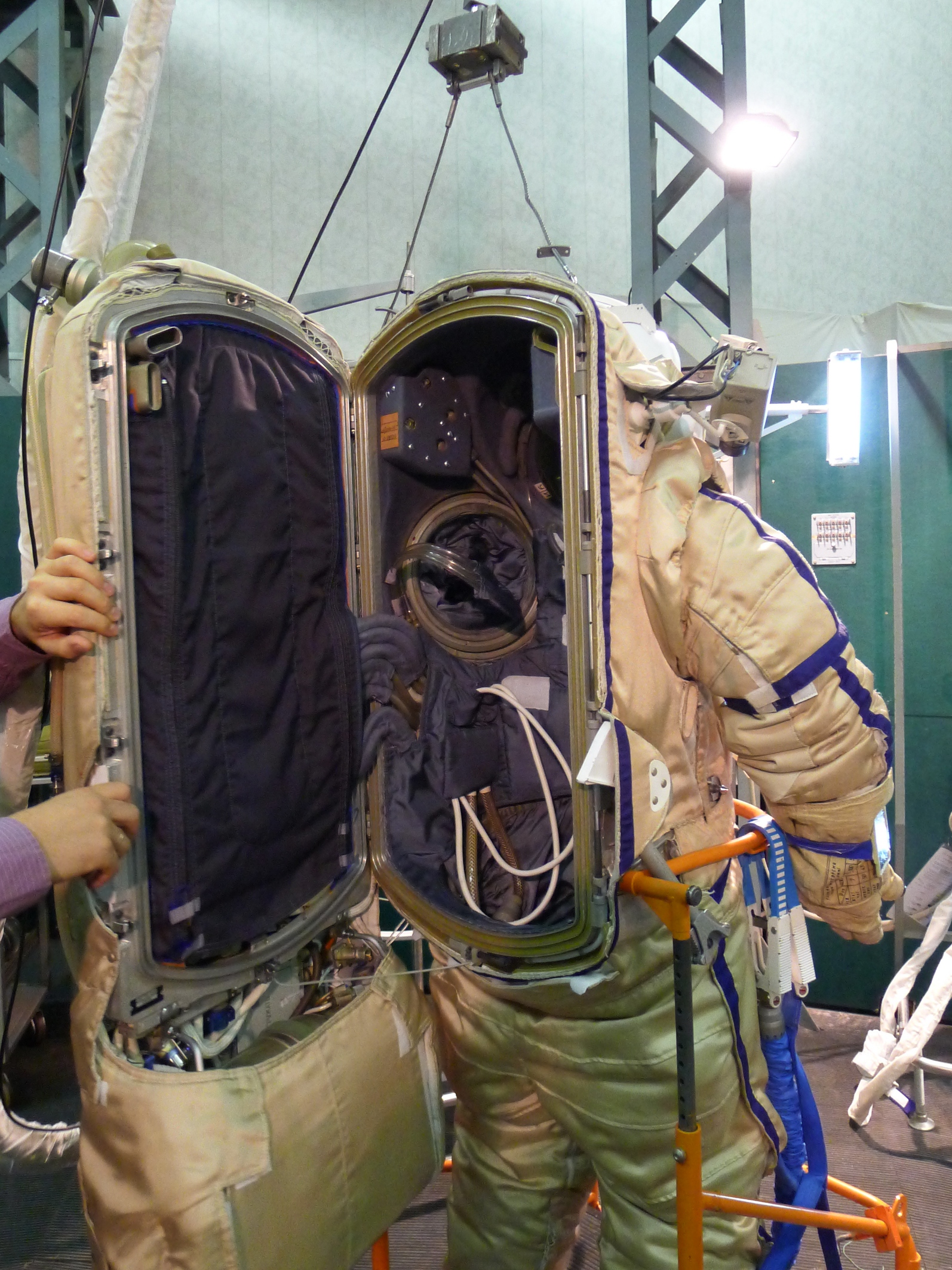 an astronaut with two other astronauts in front of him