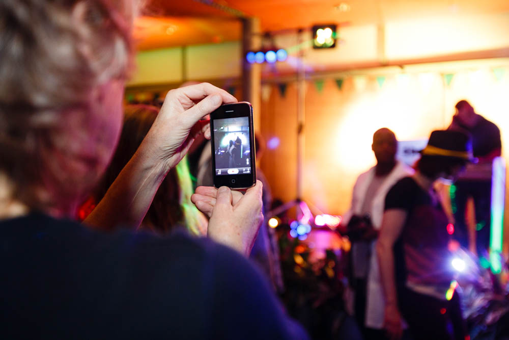 a person is looking at the po on his cell phone