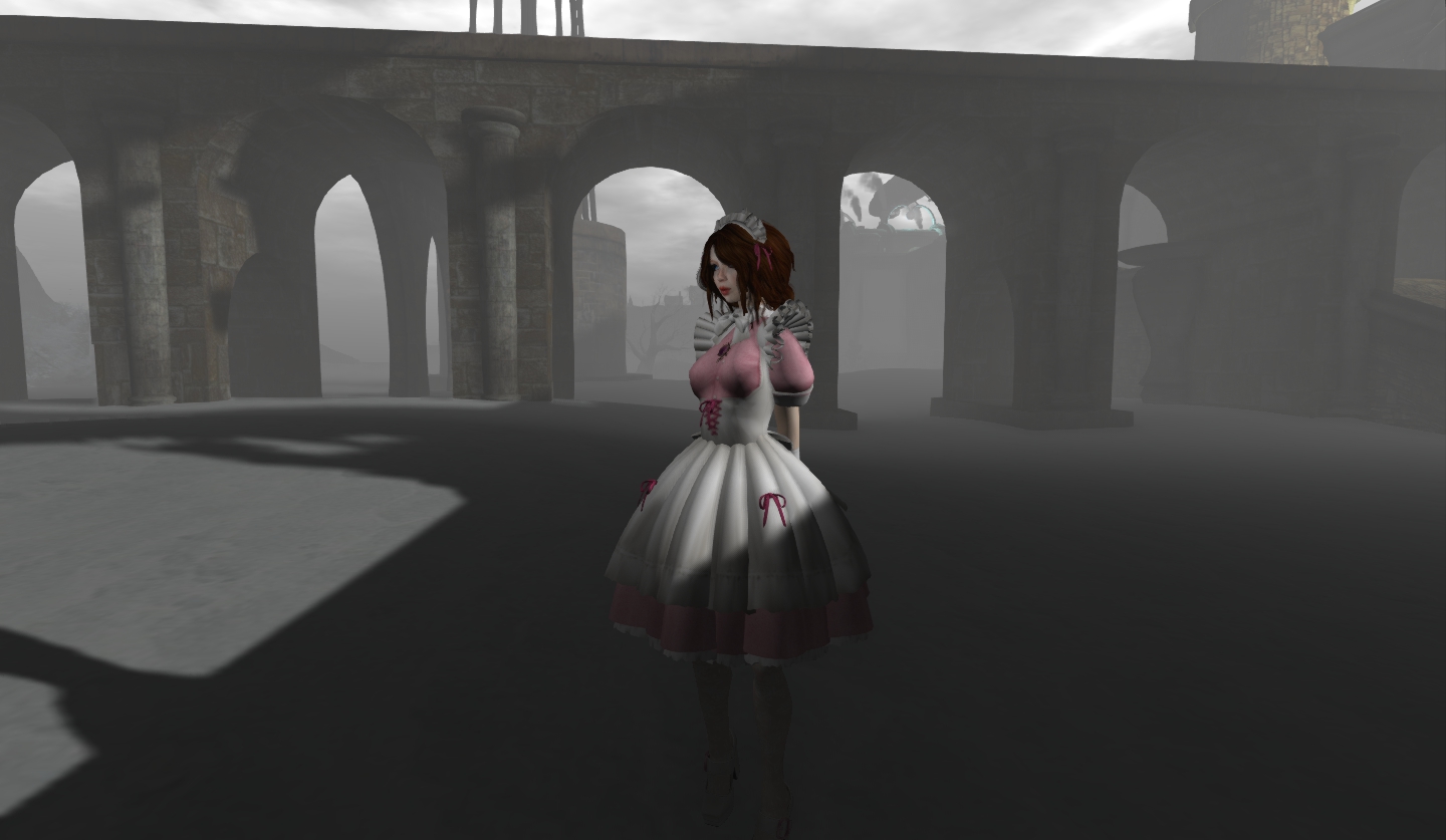 a woman in white dress standing under a bridge