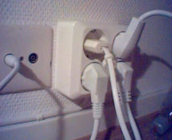 some white wires are plugged in a small outlet