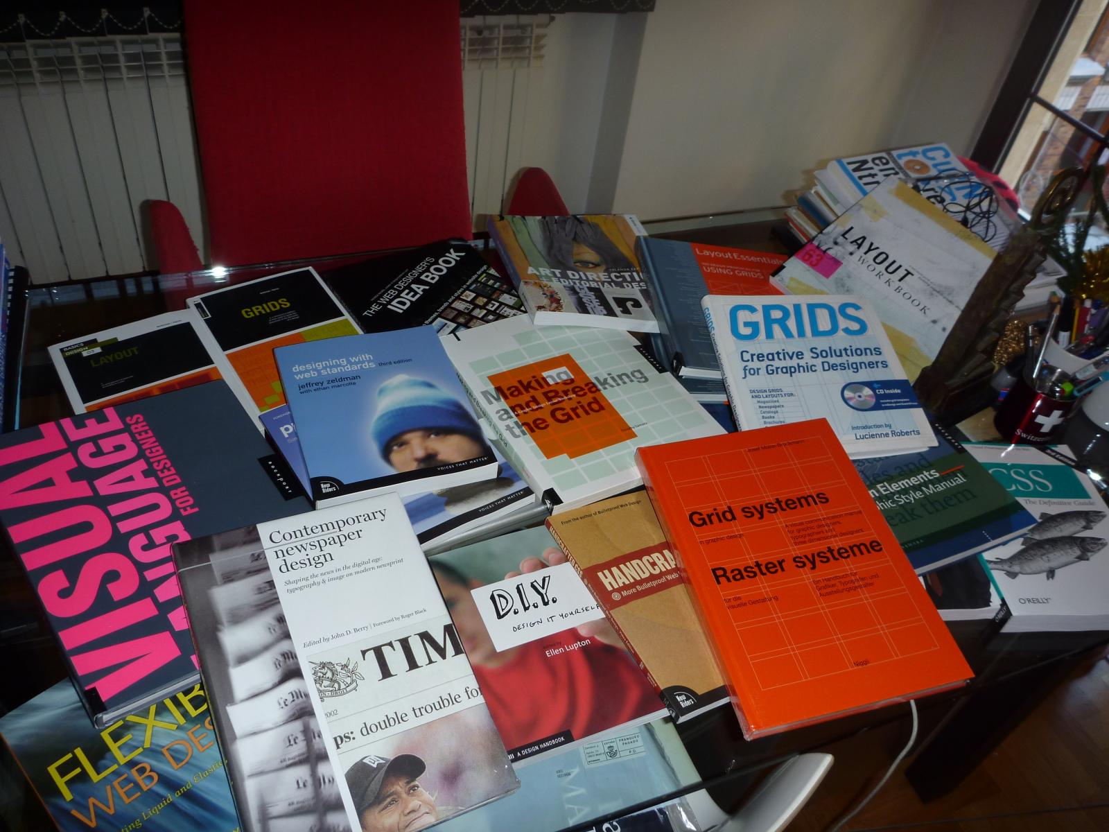some books on the table in a room