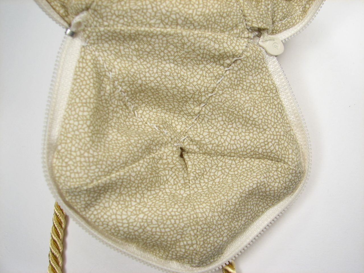 a white bag with an animal print design on the inside