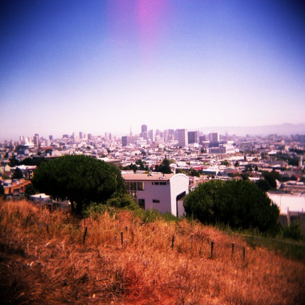 an image of the cityscape from above a hill