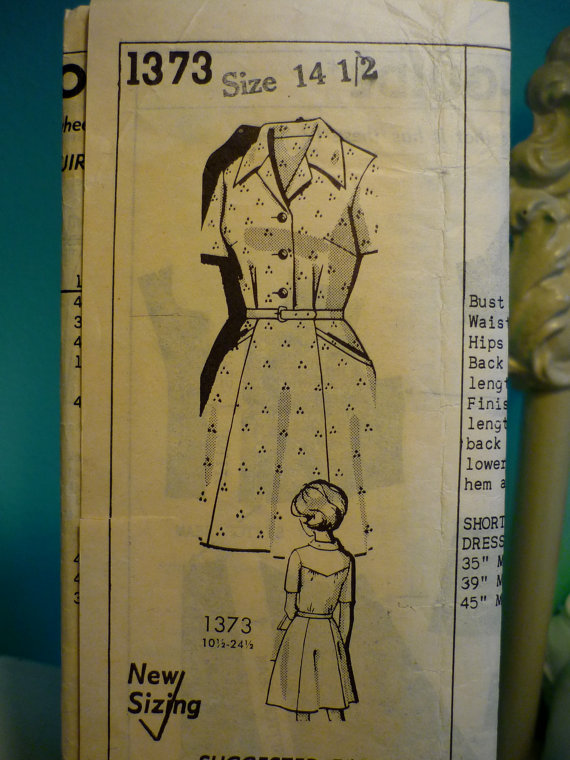 vintage dress pattern from 1974 with ons on front and an overlay with stars