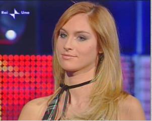 a beautiful blonde woman wearing a black halter top