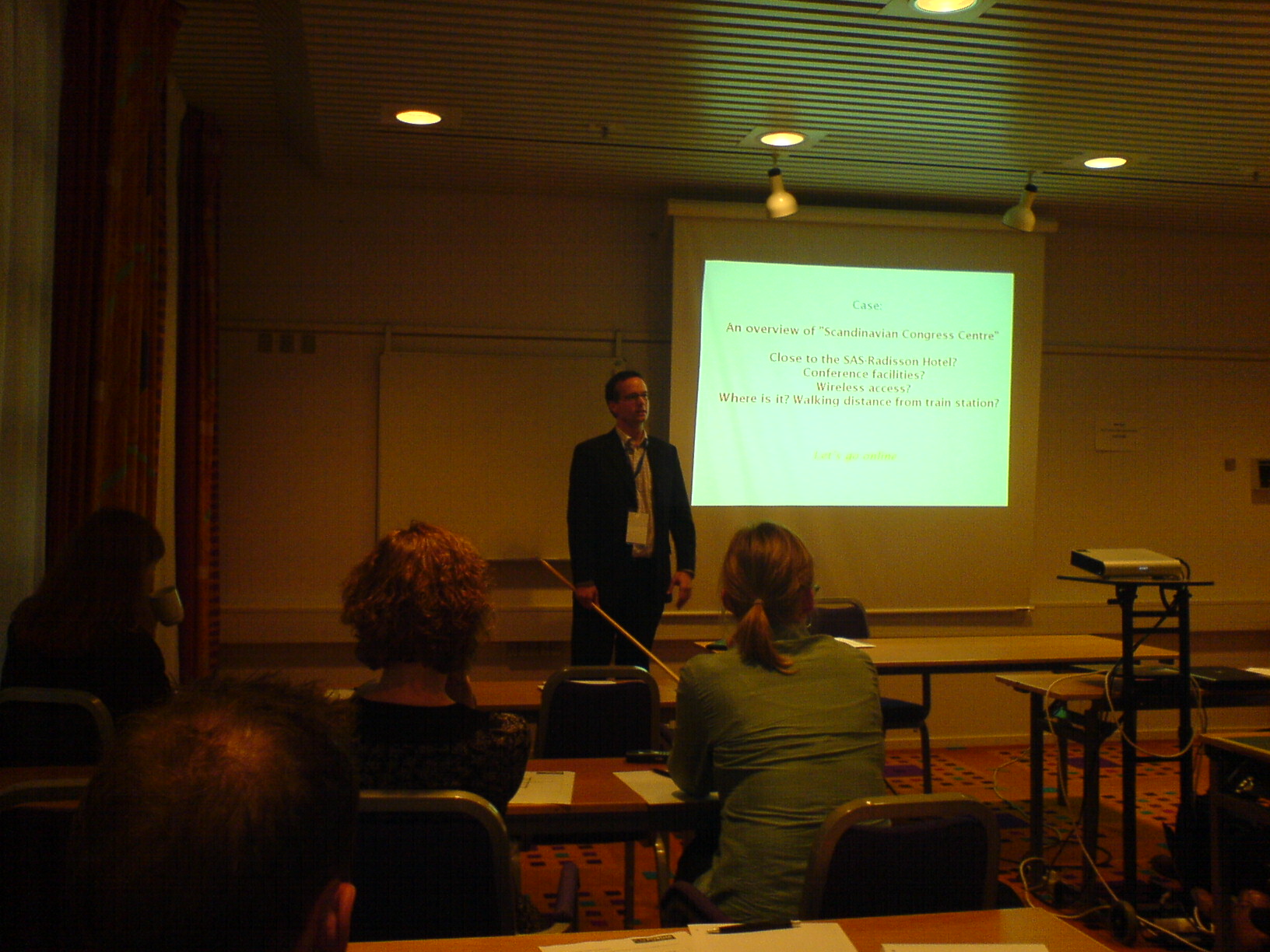 the lecture room is full of students as they present a lecture