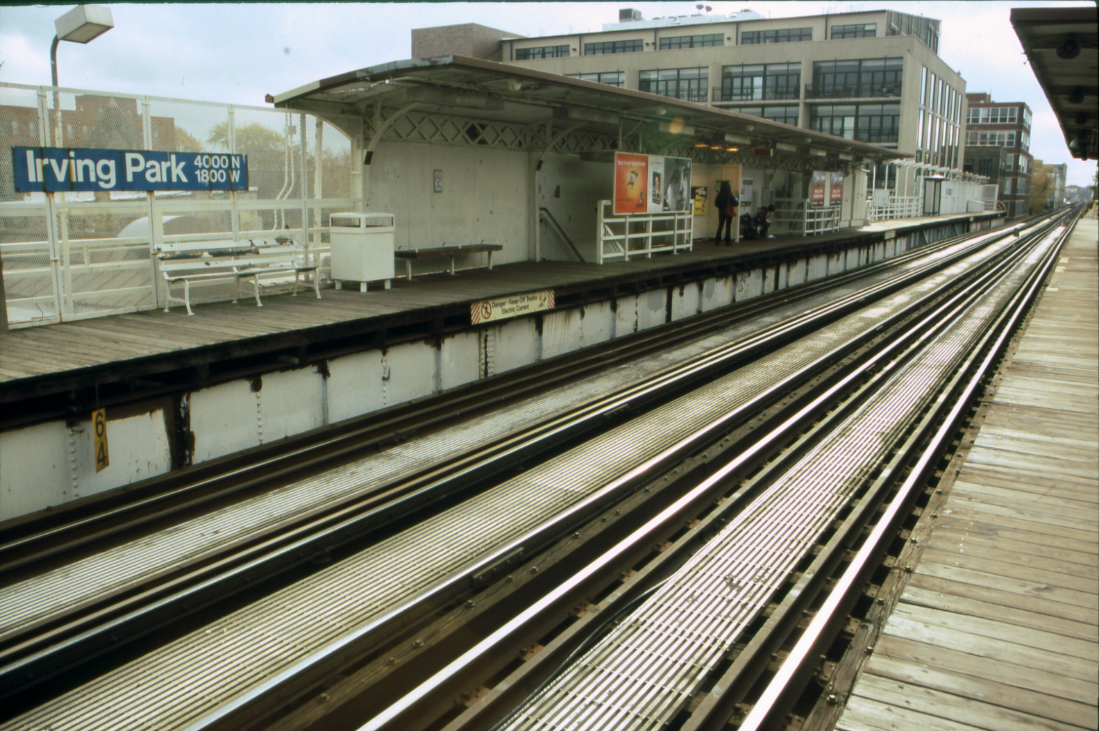 several train tracks in front of a train station