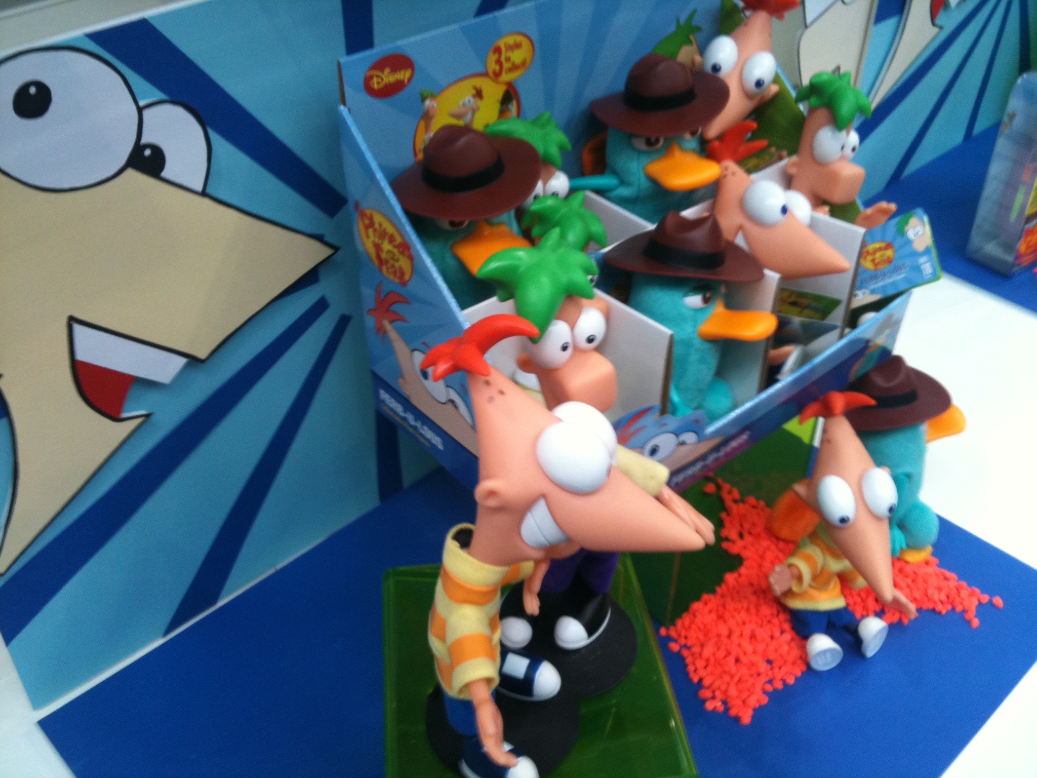 a bunch of cartoon figures on display in a room