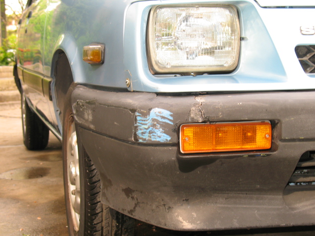 the front end of an suv with a light painted on it