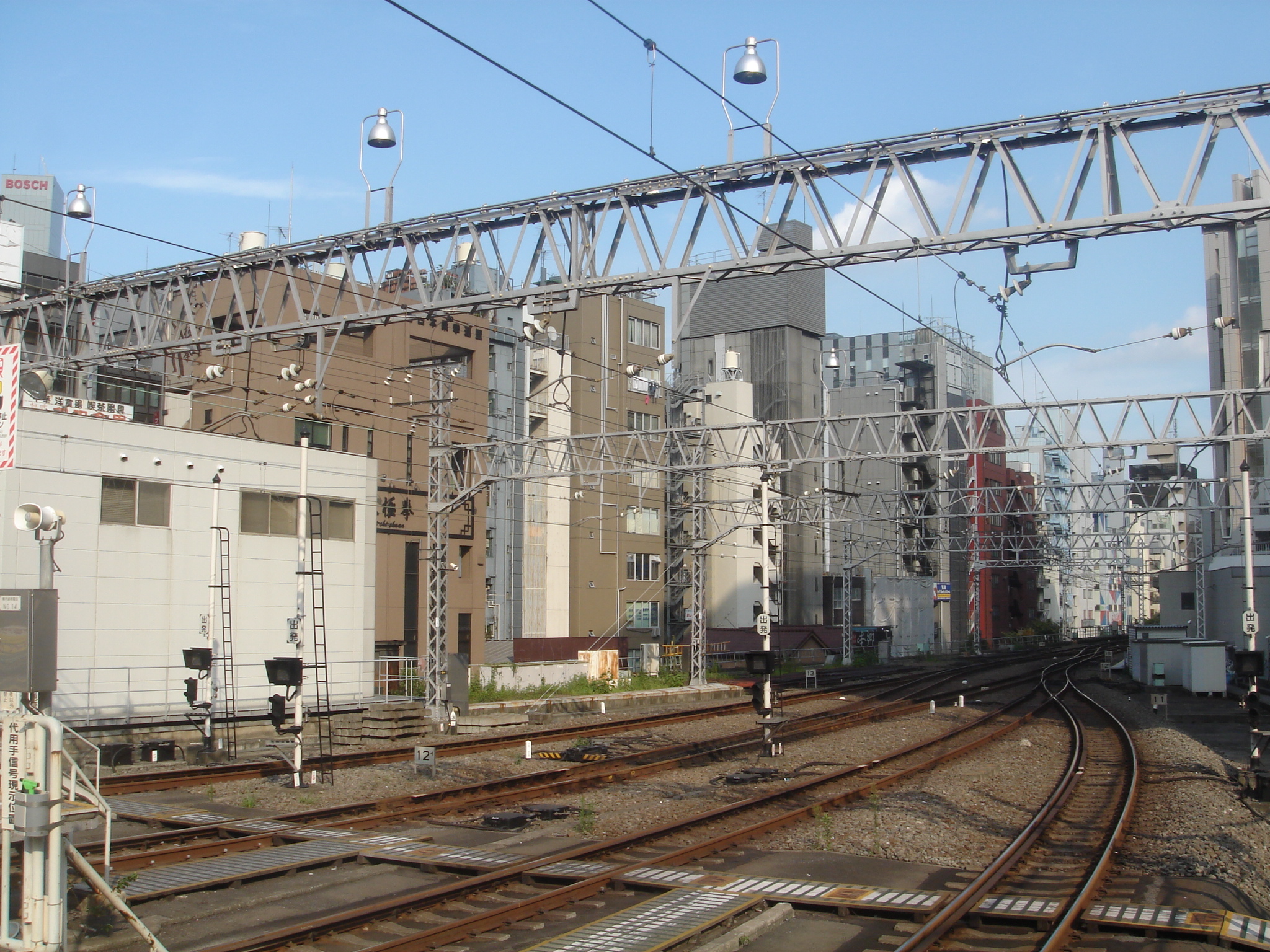 a picture of some buildings on a train track