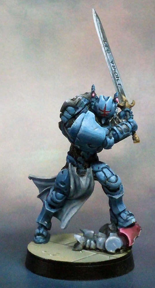 an action figure with a sword and armor on a black base