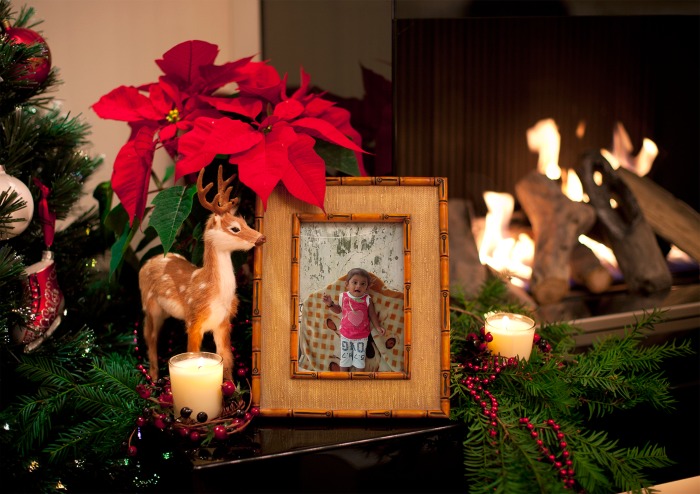 christmas scene with an unfinished framed picture surrounded by fireplace