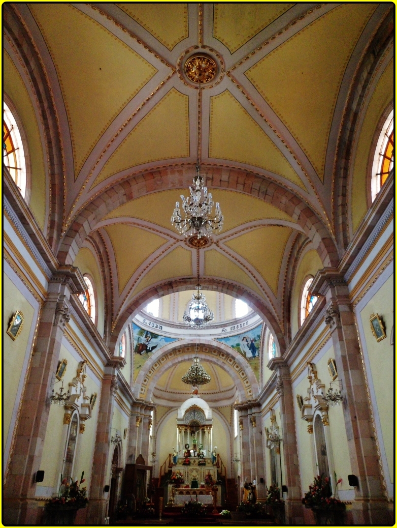 an interior view of an elegant, white church