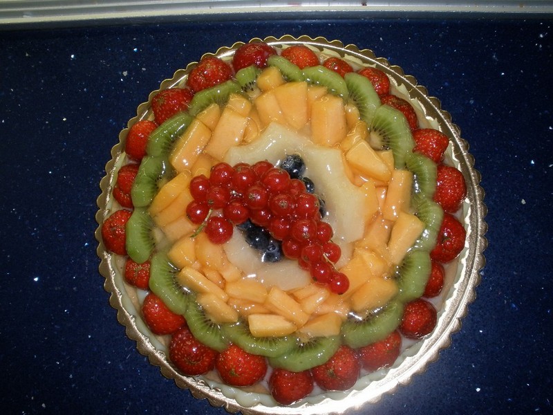 a decorated cake is on a plate on the table