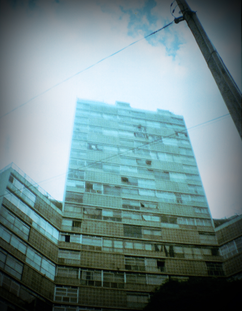 a big building is pictured from below and the sky in the background