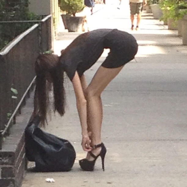 woman bending down with her shoes on