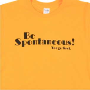 a yellow tee shirt with black and white lettering